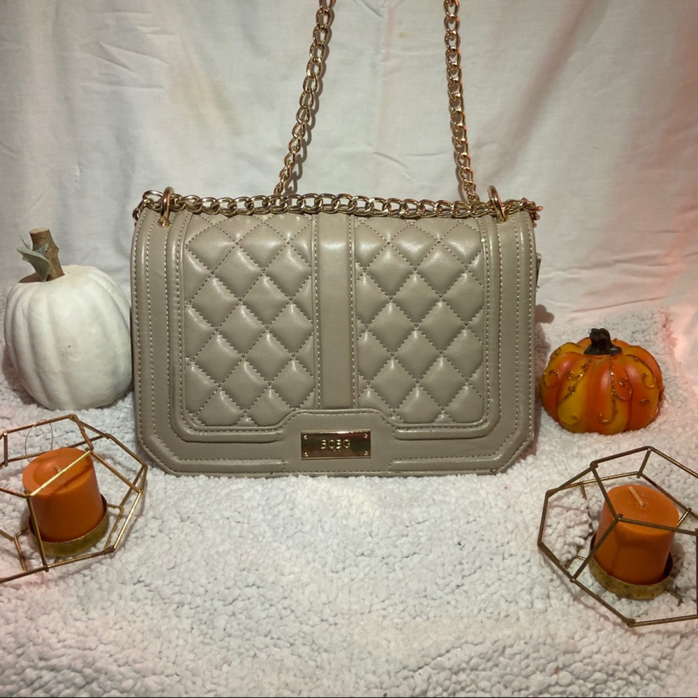 Tan BCBG Paris crossbody purse.